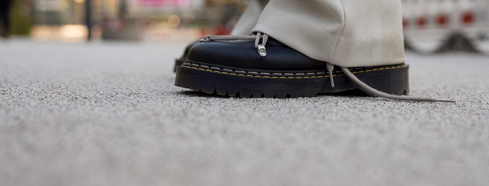 Closeup Of Cool Trendy Black Boots On Carpet