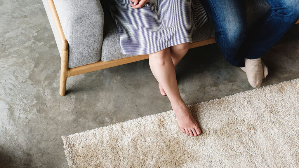 Typical Living Room Carpet With Feet Resting On Carpet Clean